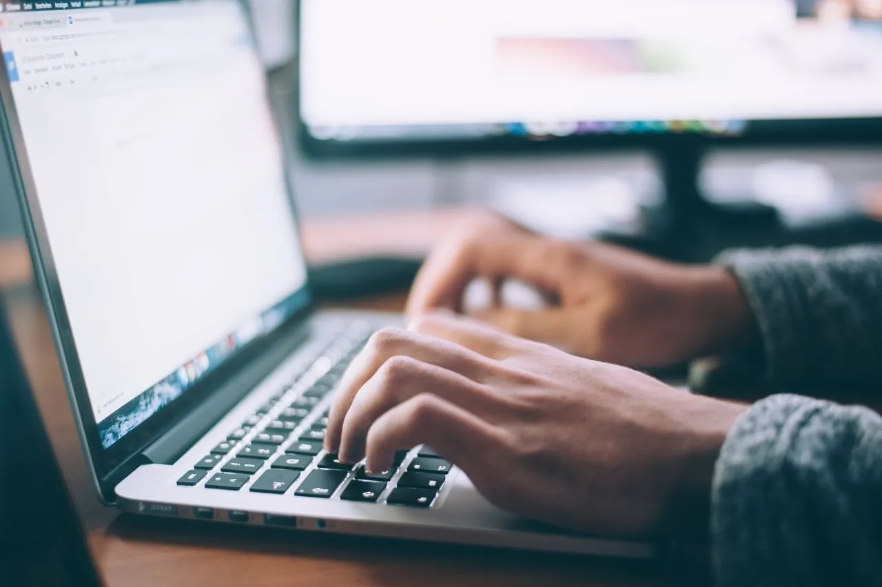 Person analyzing website data on laptop